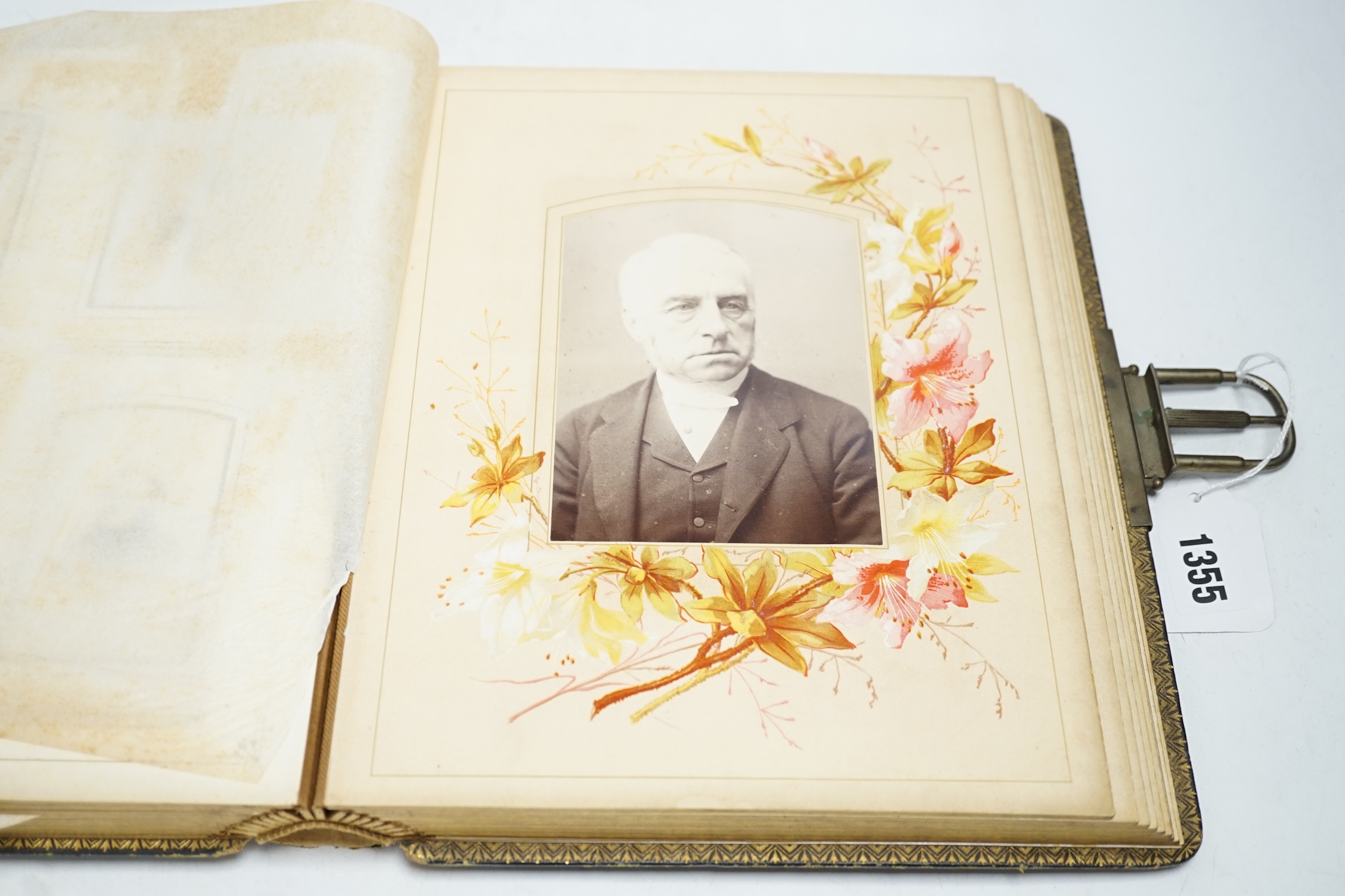 An album of Victorian sketches, photographs, scraps and prints and a leather photograph album, photograph album 29.5cm high. Condition - fair to good